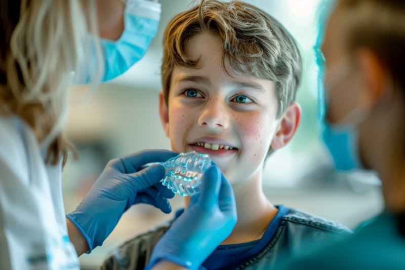 young patient being fitted for mouthguard